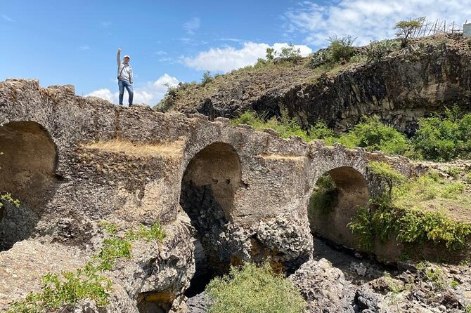 Day Trip From Addis Ababa To Debre Libanos and Portuguese Bridge - Walking across the old bridge to the waterfall and caves